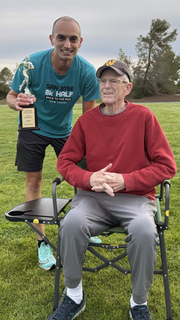Joseph holding the Walt Van Zant club trophy